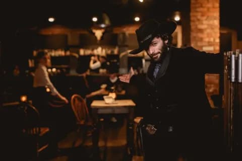 A Moonshine Saloon character welcoming guests into the western set